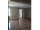 Spacious living room featuring hardwood floors and an open floor plan at 172 Rue Fontaine, Lithonia, GA 30038