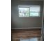 Well-lit bedroom with hardwood floors and a window offering an outside view at 172 Rue Fontaine, Lithonia, GA 30038