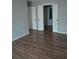 Main bedroom with hardwood floors and an ensuite bathroom at 172 Rue Fontaine, Lithonia, GA 30038