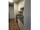 Kitchen with white cabinets and granite countertops at 172 Rue Fontaine, Lithonia, GA 30038