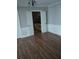 Dining room with hardwood floors and a view into the kitchen at 172 Rue Fontaine, Lithonia, GA 30038