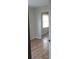 Simple bedroom with hardwood floors and an adjoining room at 172 Rue Fontaine, Lithonia, GA 30038