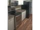 Kitchen with stainless steel appliances and wood floor at 172 Rue Fontaine, Lithonia, GA 30038