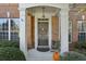 Inviting front entrance with porch and autumn decor at 155 Westchester Se Dr, Smyrna, GA 30082