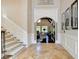 Bright and spacious entryway with high ceilings and a view into the living room at 6308 Woodlake Dr, Buford, GA 30518
