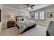 Spacious bedroom with a king-size bed and plush carpeting at 6308 Woodlake Dr, Buford, GA 30518