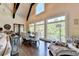 Relaxing living area with a wall of windows overlooking the lake at 6308 Woodlake Dr, Buford, GA 30518