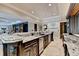 Modern bar with granite countertop and stainless steel appliances at 6308 Woodlake Dr, Buford, GA 30518