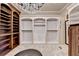 Large walk-in closet with custom shelving and hanging rods at 6308 Woodlake Dr, Buford, GA 30518