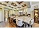 Spacious kitchen with granite island, custom cabinetry, and copper farm sink at 6308 Woodlake Dr, Buford, GA 30518