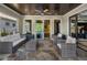 Relaxing outdoor patio with wicker furniture and a stone floor at 6308 Woodlake Dr, Buford, GA 30518