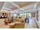 Spacious basement rec room with coffered ceiling and access to backyard at 6308 Woodlake Dr, Buford, GA 30518
