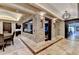 Elegant basement features a wine room, bar, and game area at 6308 Woodlake Dr, Buford, GA 30518