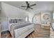 Bright bedroom with a king-size bed and herringbone wood floors at 6308 Woodlake Dr, Buford, GA 30518