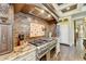 High-end kitchen features a professional range and custom cabinetry at 6308 Woodlake Dr, Buford, GA 30518