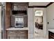Wine bar with built in coffee maker and access to dining room at 6308 Woodlake Dr, Buford, GA 30518