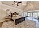 Luxurious main bedroom with sitting area and high ceilings at 6308 Woodlake Dr, Buford, GA 30518