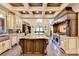 Gourmet kitchen boasts a large island, custom cabinetry, and high-end appliances at 6308 Woodlake Dr, Buford, GA 30518