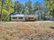 Simple white house exterior with a small front porch at 3534 Dahlonega Hwy, Cumming, GA 30028