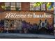 Welcome to Inman Park mural on brick building at 418 N Highland Ne Ave, Atlanta, GA 30307