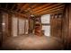Unfinished interior with exposed beams and fireplace at 418 N Highland Ne Ave, Atlanta, GA 30307