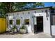 Victory bar with an open door and plants at 418 N Highland Ne Ave, Atlanta, GA 30307