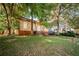 A charming yellow bungalow, showing the front of the property at 418 N Highland Ne Ave, Atlanta, GA 30307