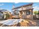 Two-story house back, featuring a large patio and surrounding yard at 1712 Country Wood Dr, Hoschton, GA 30548