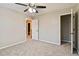 Spacious bedroom with ceiling fan, carpet, and walk-in closet at 1712 Country Wood Dr, Hoschton, GA 30548