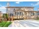 Two-story house back view, showcasing a deck, patio, and partial yard at 1712 Country Wood Dr, Hoschton, GA 30548