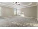 Main bedroom with ceiling fan and neutral wall colors at 1712 Country Wood Dr, Hoschton, GA 30548