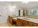 Primary bathroom with double vanity and a soaking tub at 1712 Country Wood Dr, Hoschton, GA 30548