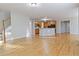 Kitchen with hardwood floors, island, and wooden cabinetry at 1712 Country Wood Dr, Hoschton, GA 30548