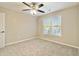 Bright bedroom with ceiling fan and neutral carpeting at 1712 Country Wood Dr, Hoschton, GA 30548