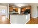 Spacious kitchen with granite countertops and wood cabinets at 1712 Country Wood Dr, Hoschton, GA 30548