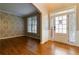 Bright entryway with hardwood floors and geometric wall accent at 1712 Country Wood Dr, Hoschton, GA 30548