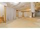Unfinished basement with high ceilings and ample space at 1712 Country Wood Dr, Hoschton, GA 30548