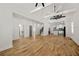 Spacious living area with hardwood floors, high ceilings, exposed beams, and an open floor plan at 865 Mcdaniel Sw St, Atlanta, GA 30310
