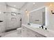 Elegant bathroom with double vanity, marble tile, and a large mirror at 865 Mcdaniel Sw St, Atlanta, GA 30310