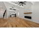 Open concept living room with hardwood floors, high ceilings, exposed beams, and a view of the kitchen at 865 Mcdaniel Sw St, Atlanta, GA 30310