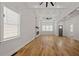 Open concept living room with hardwood floors, high ceilings, exposed beams, and ample natural light at 865 Mcdaniel Sw St, Atlanta, GA 30310