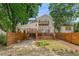 Two-story home with carport, deck and modern wood fence at 865 Mcdaniel Sw St, Atlanta, GA 30310