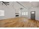 Bright and spacious living room featuring hardwood floors, high ceilings, exposed beams, and a modern fireplace at 865 Mcdaniel Sw St, Atlanta, GA 30310