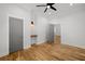 Spacious bedroom with hardwood floors, neutral walls, and access to another room at 865 Mcdaniel Sw St, Atlanta, GA 30310