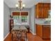 Bright dining area with wood floors and a charming table setting at 2116 Lake Ridge Ter, Lawrenceville, GA 30043