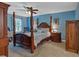 Spacious main bedroom with a four-poster bed at 2116 Lake Ridge Ter, Lawrenceville, GA 30043