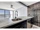 Contemporary kitchen featuring marble countertops and dark cabinetry at 1280 W Peachtree Nw St # 1504, Atlanta, GA 30309