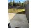 Private backyard with grassy area and concrete patio at 7083 Gladstone Cir, Stonecrest, GA 30038