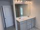 Bathroom with double vanity and large mirror at 7083 Gladstone Cir, Stonecrest, GA 30038