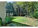 Large backyard with lush lawn, deck, and playset at 1719 Cat Tail Ct, Lawrenceville, GA 30044